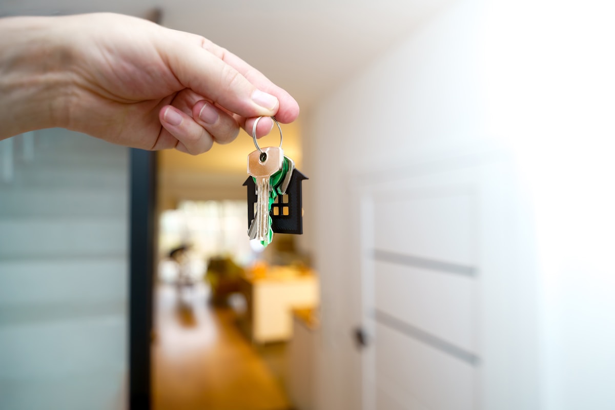 Keys in hand at a front door